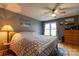 Comfortable main bedroom with wood flooring, a ceiling fan, and neutral-colored walls at 115 Setter Ct, Statesville, NC 28625