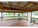 Screened porch featuring an elliptical, table, and chairs at 115 Setter Ct, Statesville, NC 28625