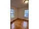 Bedroom features hardwood floors and windows with natural light at 120 3Rd Ave, Conover, NC 28613