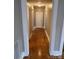 Hallway boasts newly finished hardwood floors and access to the other rooms at 120 3Rd Ave, Conover, NC 28613