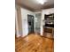 Updated kitchen features new appliances, white cabinetry, and ample storage space, and wood flooring at 120 3Rd Ave, Conover, NC 28613