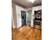 Updated kitchen features new appliances, white cabinetry, and ample storage space, and wood flooring at 120 3Rd Ave, Conover, NC 28613