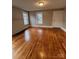 Bright living room with wood floors, complemented by fresh paint, windows and ample natural light at 120 3Rd Ave, Conover, NC 28613