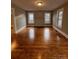 Inviting living room featuring beautiful hardwood floors and natural light from multiple windows at 120 3Rd Ave, Conover, NC 28613