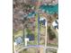 A picturesque aerial view of property lines, mature trees, and a lush, landscaped yard at 129 Ryleigh Dan Pl, Mooresville, NC 28115