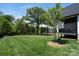 Expansive backyard with lush green grass and mature trees, perfect for outdoor activities and relaxation at 129 Ryleigh Dan Pl, Mooresville, NC 28115