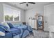 Bright bedroom with a comfortable bed, dresser, and large window offering outdoor views at 129 Ryleigh Dan Pl, Mooresville, NC 28115