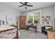 Well-lit bedroom featuring a home office area, with a writing desk and decor at 129 Ryleigh Dan Pl, Mooresville, NC 28115