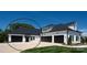 Beautiful two-story home featuring white siding, black roof, and a spacious three-car garage at 129 Ryleigh Dan Pl, Mooresville, NC 28115