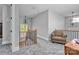 Upstairs hallway with plush carpeting, wooden banister, and decorative lighting fixtures at 129 Ryleigh Dan Pl, Mooresville, NC 28115