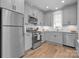 Modern kitchen with stainless steel appliances, granite countertops, and ample cabinet space for storage at 129 Ryleigh Dan Pl, Mooresville, NC 28115