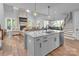 Open-concept kitchen features granite countertops, stainless steel appliances and a large center island at 129 Ryleigh Dan Pl, Mooresville, NC 28115