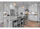 Bright kitchen featuring a large island with bar seating, stainless steel appliances, and ample counter space at 129 Ryleigh Dan Pl, Mooresville, NC 28115