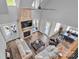 Overhead view of the living room with a brick fireplace, high ceilings, and hardwood floors at 129 Ryleigh Dan Pl, Mooresville, NC 28115