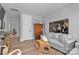 Cozy living room featuring stylish decor, hardwood floors, and ample natural light for a welcoming ambiance at 129 Ryleigh Dan Pl, Mooresville, NC 28115