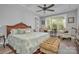 Comfortable bedroom with large window, decorative ceiling fan, and cozy seating at 129 Ryleigh Dan Pl, Mooresville, NC 28115