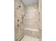 Walk-in shower with tile surround, bench, and dual shower heads at 129 Ryleigh Dan Pl, Mooresville, NC 28115
