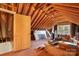 Unfinished attic space featuring exposed rafters, natural light, and potential for custom design at 140 Rustic Way Ln, Mooresville, NC 28117