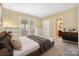 Comfortable bedroom with built-in shelving, a large window, and an ensuite bathroom at 140 Rustic Way Ln, Mooresville, NC 28117