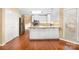Open kitchen area with center island, stainless steel appliances, and hardwood floors at 140 Rustic Way Ln, Mooresville, NC 28117