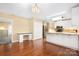 Kitchen with desk, white cabinets, stainless appliances and hardwood floors at 140 Rustic Way Ln, Mooresville, NC 28117