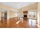 Vaulted living room featuring brick fireplace and hardwood flooring at 140 Rustic Way Ln, Mooresville, NC 28117