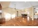 Large living room with hardwood floors, fireplace, and open floorplan at 140 Rustic Way Ln, Mooresville, NC 28117