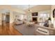 Bright living room with fireplace, hardwood floors, and neutral decor at 140 Rustic Way Ln, Mooresville, NC 28117