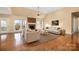 Spacious living room with fireplace, hardwood floors, and ample seating at 140 Rustic Way Ln, Mooresville, NC 28117