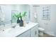 This bathroom features double sinks and a decorative mirror at 1416 6Th Ne St, Hickory, NC 28601
