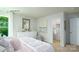 Comfortable bedroom with closet, white dresser, and window showing the outdoors at 1416 6Th Ne St, Hickory, NC 28601