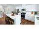 Bright kitchen with white cabinets, stainless steel appliances, and a quartz island with seating at 1416 6Th Ne St, Hickory, NC 28601