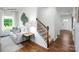 Open-concept living space featuring a staircase, view to entry, and view to outdoors at 1416 6Th Ne St, Hickory, NC 28601