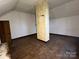 Small bedroom with hardwood floors and an exposed post in the center of the room at 148 Center St, Chester, SC 29706