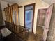 Hallway featuring staircase and entrance to both a bedroom and a full bathroom with a shower and toilet at 148 Center St, Chester, SC 29706