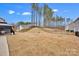 View of expansive backyard including a pergola covered patio at 155 Autumnwood Rd, Troutman, NC 28166