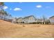 Spacious backyard with manicured lawn and black metal fence at 155 Autumnwood Rd, Troutman, NC 28166