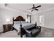 Spacious bedroom boasts tray ceiling and decorative ceiling fan at 155 Autumnwood Rd, Troutman, NC 28166