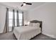 Serene bedroom featuring soft lighting, neutral tones, and a comfortable bed with a padded headboard at 155 Autumnwood Rd, Troutman, NC 28166