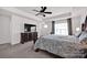 Bedroom features ceiling fan, large window and neutral color palette at 155 Autumnwood Rd, Troutman, NC 28166