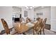 Classic dining room with elegant wood table, decorative chairs, and views into an open kitchen at 155 Autumnwood Rd, Troutman, NC 28166