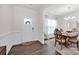 Inviting foyer flows into the dining room, showcasing hardwood floors and crisp, white trim at 155 Autumnwood Rd, Troutman, NC 28166
