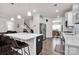 Spacious kitchen features a large island, stainless steel appliances, and adjacent dining area at 155 Autumnwood Rd, Troutman, NC 28166