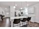 Contemporary kitchen with a large island, pendant lighting, and white cabinetry at 155 Autumnwood Rd, Troutman, NC 28166