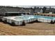 Community pool area featuring splash pad and ample lounge space at 155 Autumnwood Rd, Troutman, NC 28166