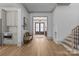 Open foyer features light hardwood floors and an inviting view of the front door at 1700 Hawthorne Ln, Charlotte, NC 28205