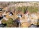 A high angle, aerial image of a single Gathering home nestled in a serene, wooded neighborhood at 3041 Mulberry Ln, Lancaster, SC 29720