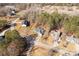Aerial of a home and neighborhood with tree-lined streets in a rural setting at 3041 Mulberry Ln, Lancaster, SC 29720