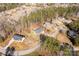 An aerial view captures the property in a tranquil neighborhood setting, surrounded by lush greenery and mature trees at 3041 Mulberry Ln, Lancaster, SC 29720