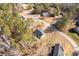 An aerial view showcases a home nestled among trees in a peaceful residential community at 3041 Mulberry Ln, Lancaster, SC 29720